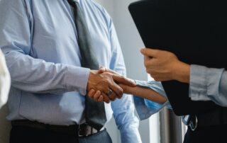 Man and Woman Hand Shake Negotiation