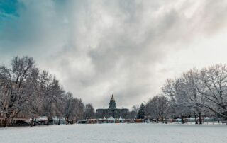 Colorado Weather Outlook 2024 | Capital building with tents and light snow covering the ground in early morning